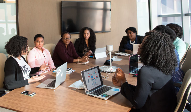 Group of trainees sat around table